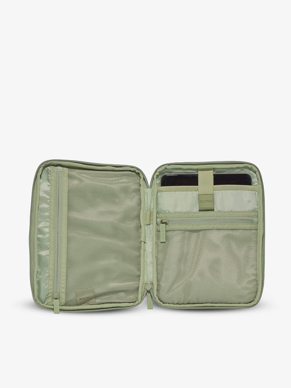 Interior of tablet organizer with zippered pockets and padded tablet sleeve in green daisy