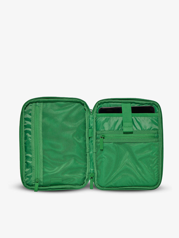 Interior of tablet organizer with zippered pockets and padded tablet sleeve in green checkerboard