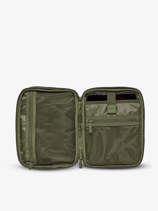 Interior of tablet organizer with zippered pockets and padded tablet sleeve in moss