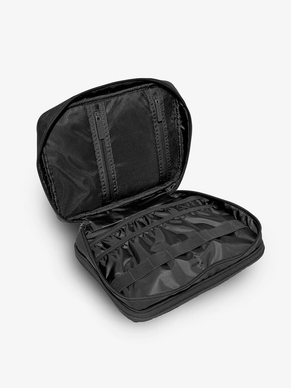 Black tablet organizer with multiple pockets for organizing electronics and belongings