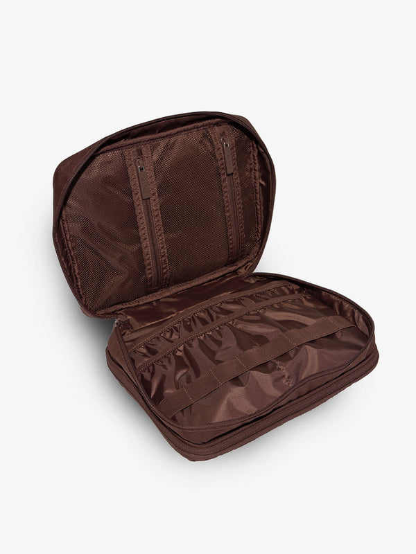 Brown tablet organizer features multiple pockets and loops for organizing belongings