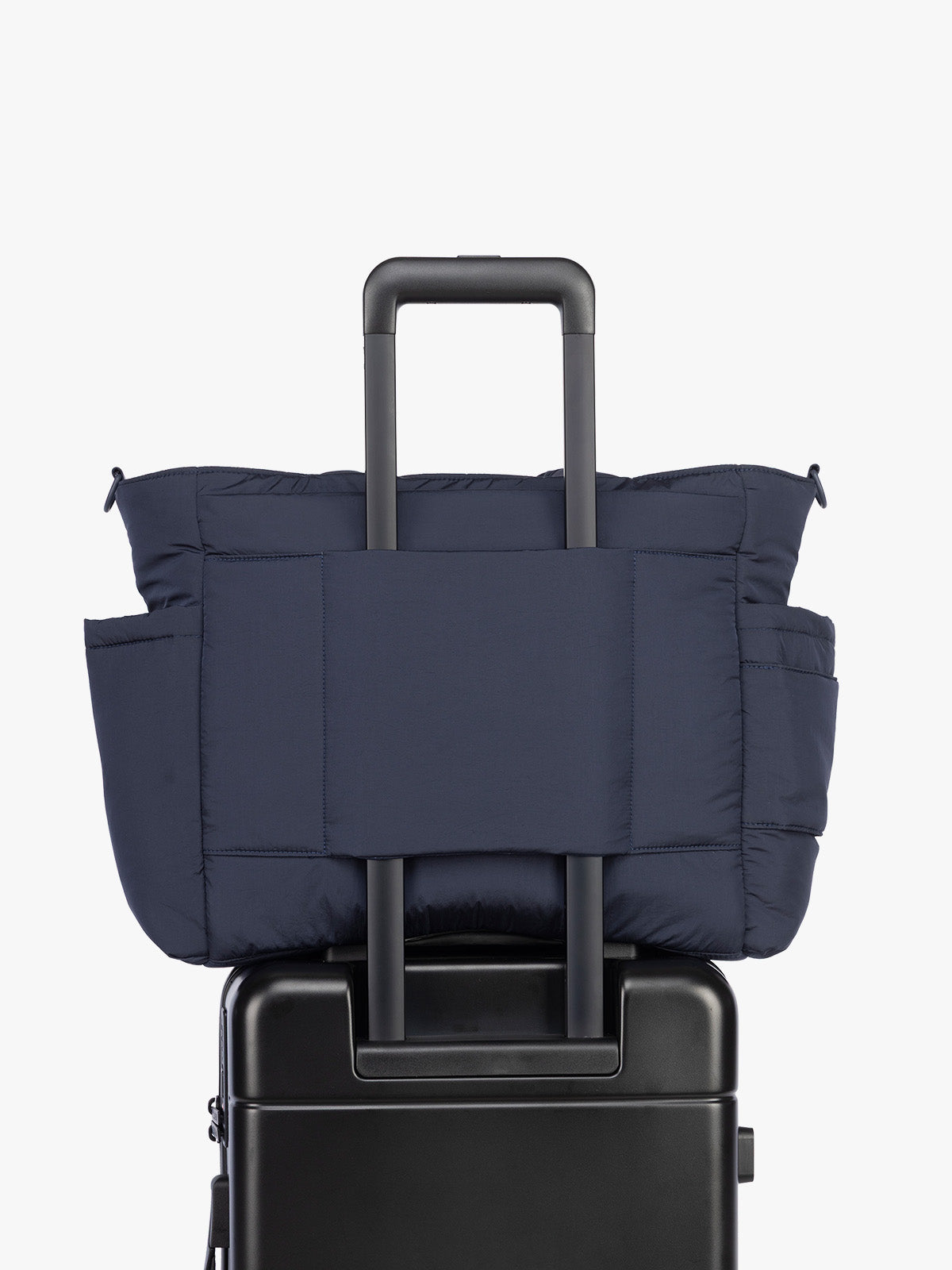 Luggage trolley sleeve of CALPAK Diaper Tote bag in blue Navy; TBB2401-NAVY