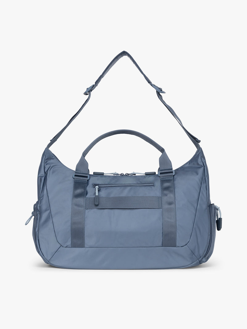 Back of CALPAK Fit Gym Duffel Bag in blue  Indigo
