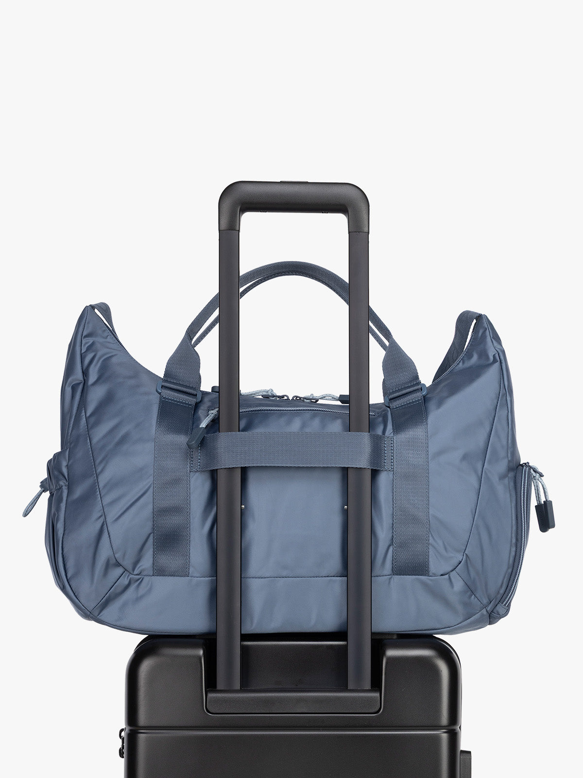 Luggage trolley sleeve for the CALPAK Fit Gym Duffel Bag in blue Indigo; TBF2401-INDIGO