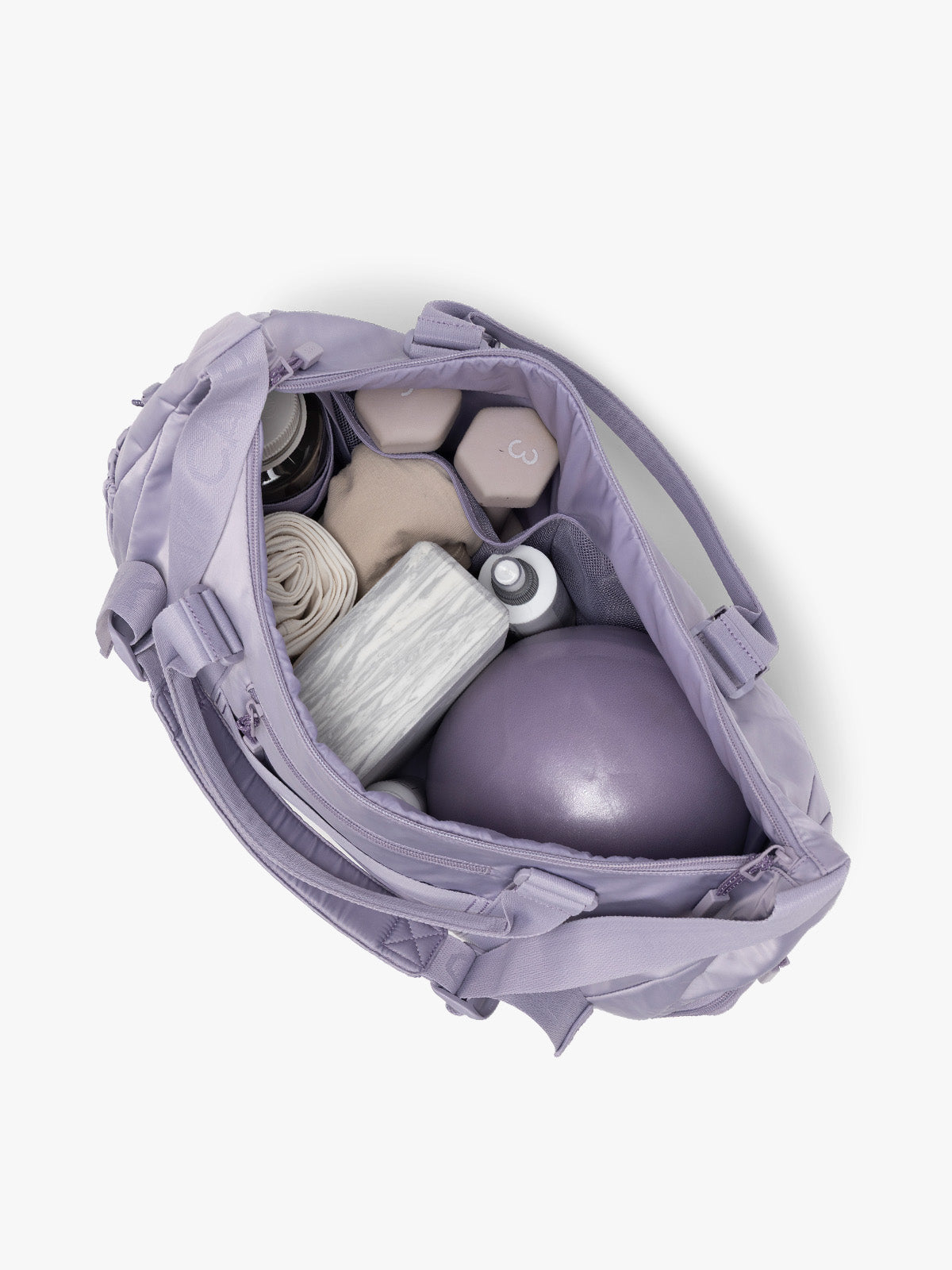 Gym items in the CALPAK Fit Gym Duffel Bag in purple Iris; TBF2401-IRIS