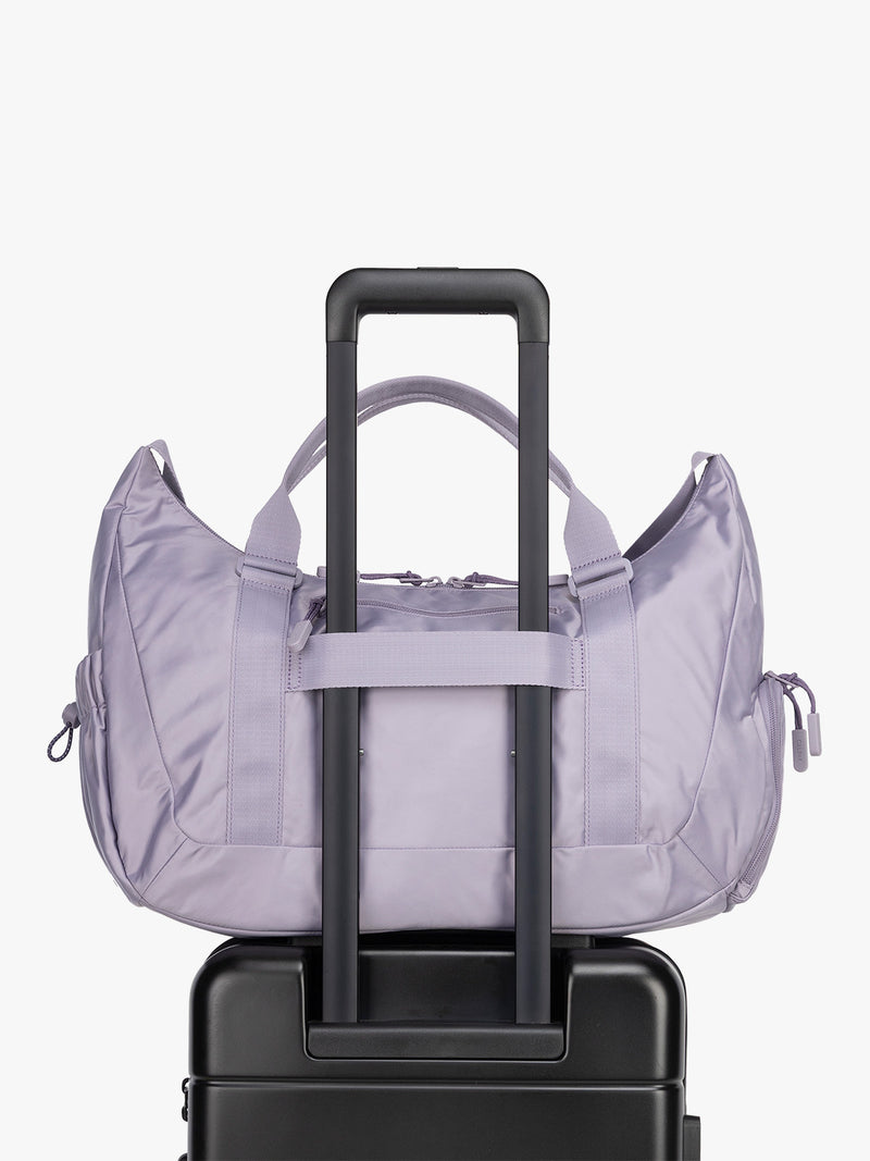Luggage trolley sleeve for the CALPAK Fit Gym Duffel Bag in purple Iris