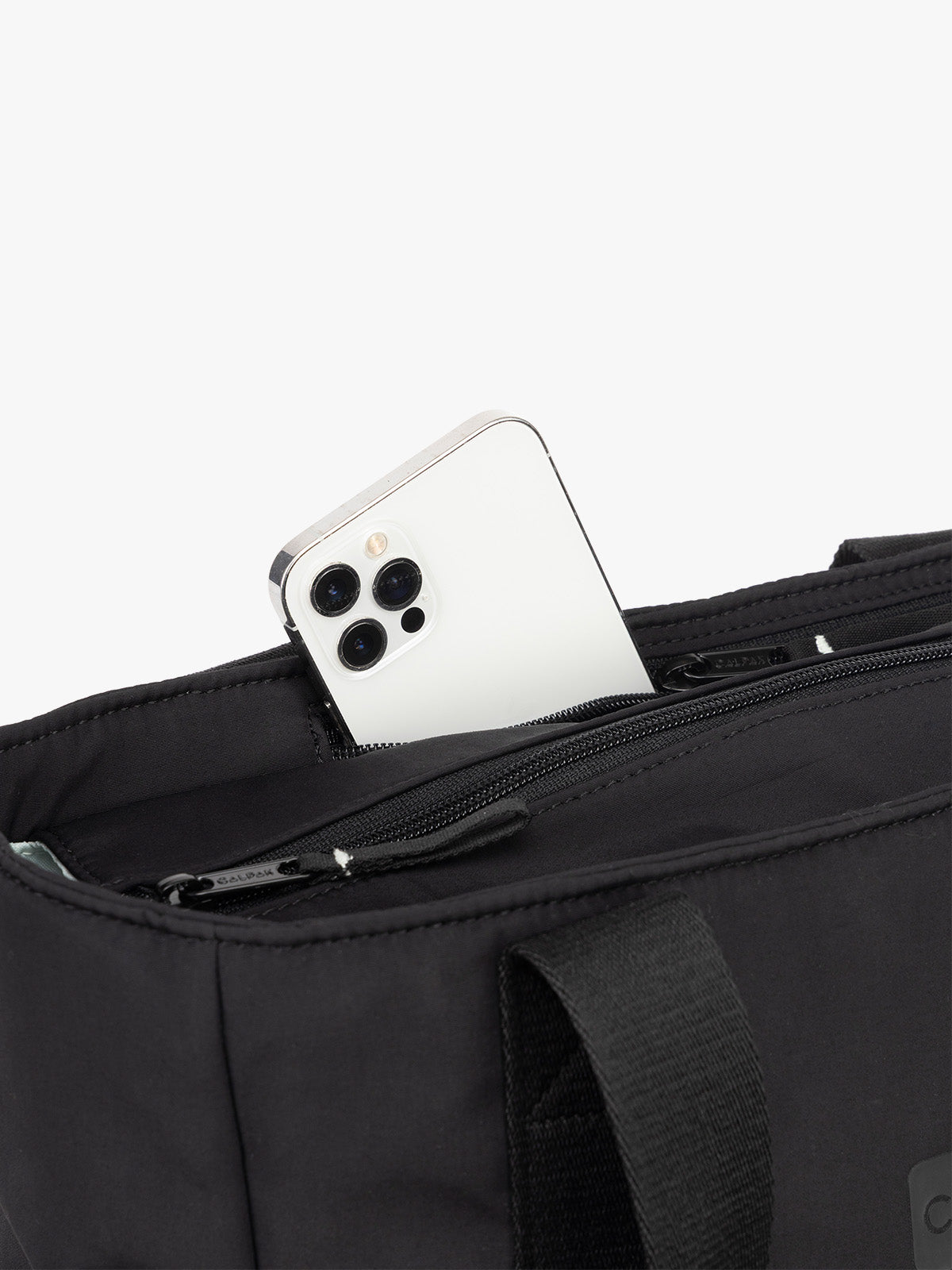 CALPAK Zippered Laptop Tote Bag in Black  on a white background with phone pocket; TCN2501-BLACK
