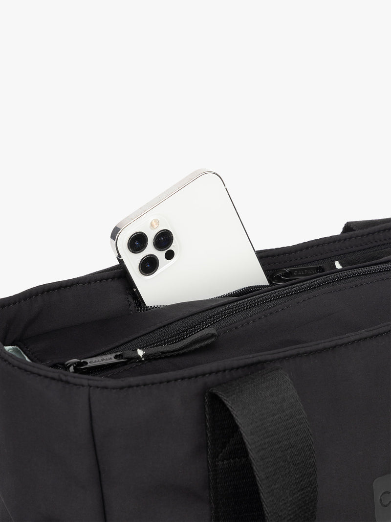 CALPAK Zippered Laptop Tote Bag in Black  on a white background with phone pocket