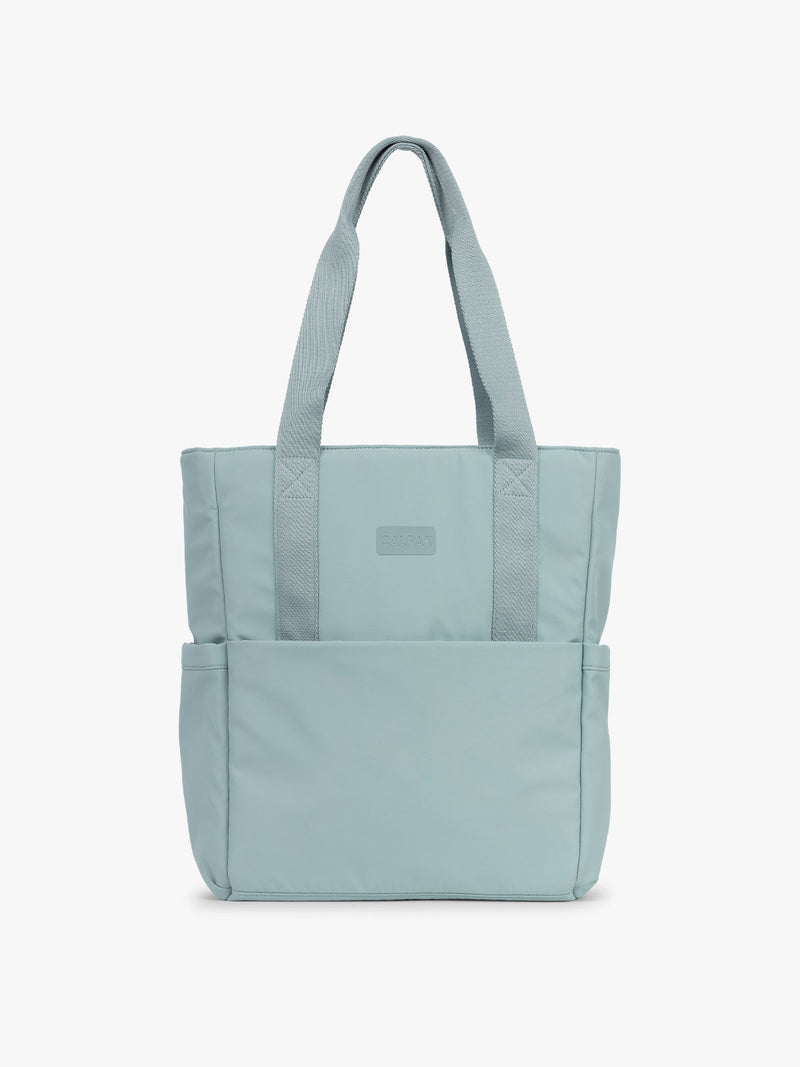 CALPAK Zippered Laptop Tote Bag in light blue Bluebell on a white background