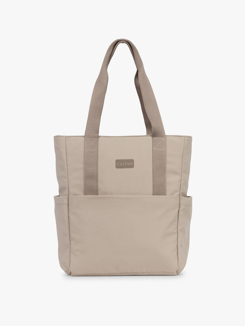 CALPAK Zippered Laptop Tote Bag in beige Greige on a white background