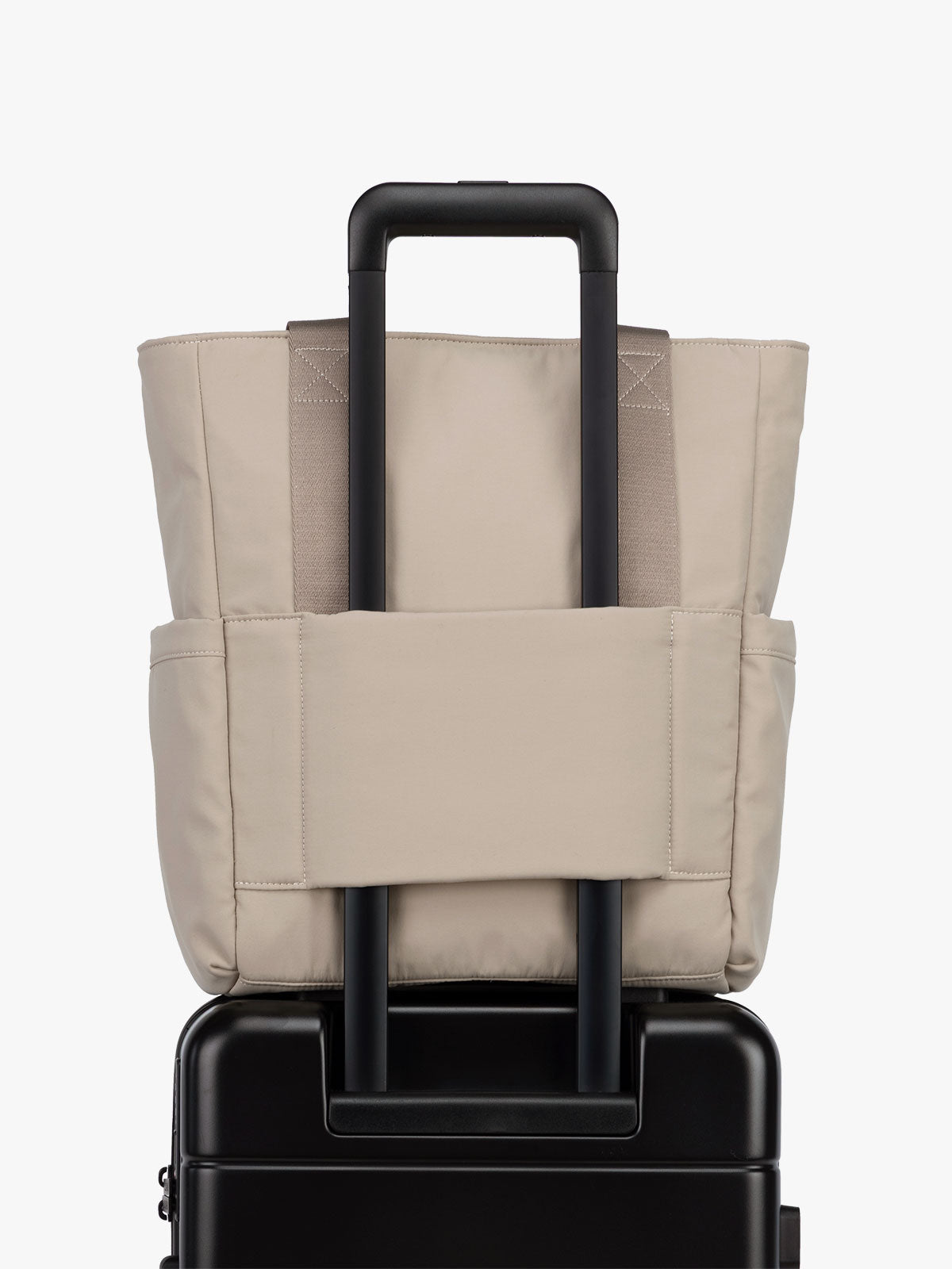 CALPAK Zippered Laptop Tote Bag in beige Greige on a white background with trolley sleeve; TCN2501-GREIGE