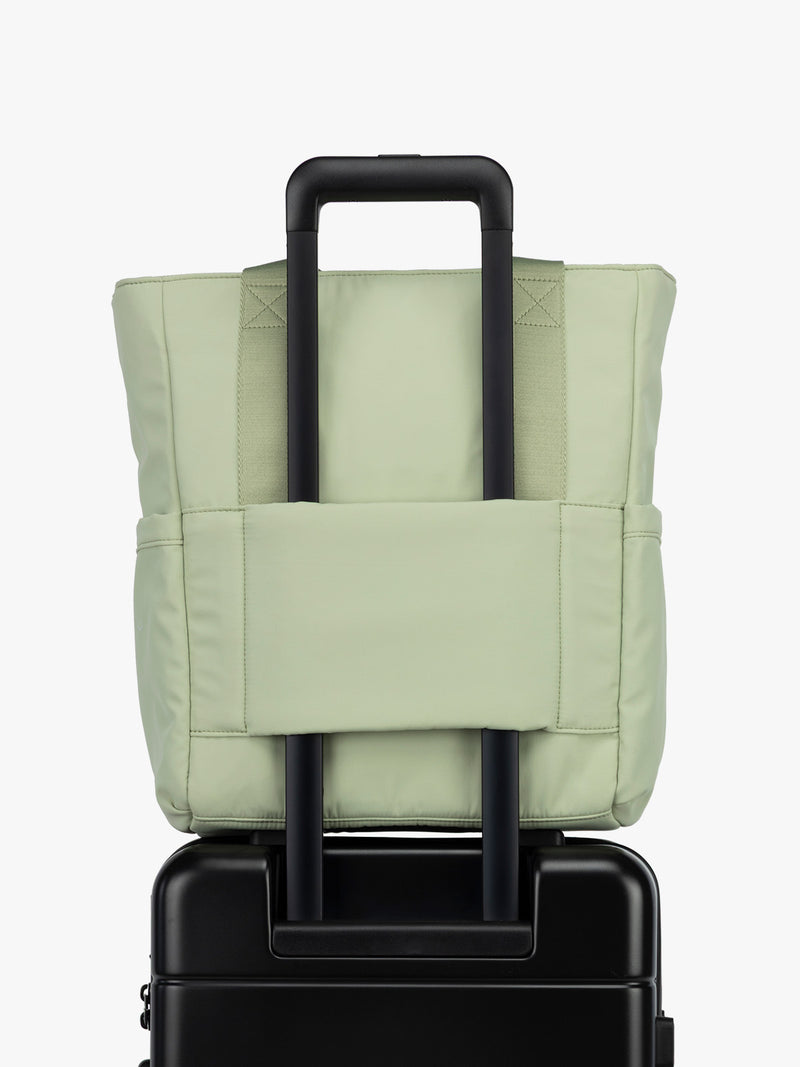 CALPAK Zippered Laptop Tote Bag in light green Meadow on a white background with trolley sleeve
