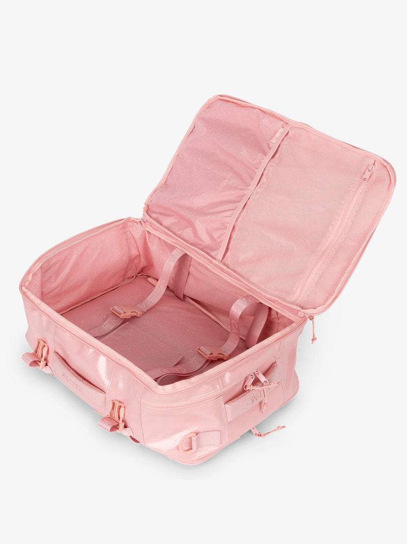 CALPAK Terra 26L Laptop Backpack Duffel with compression straps and multiple interior pockets in pink