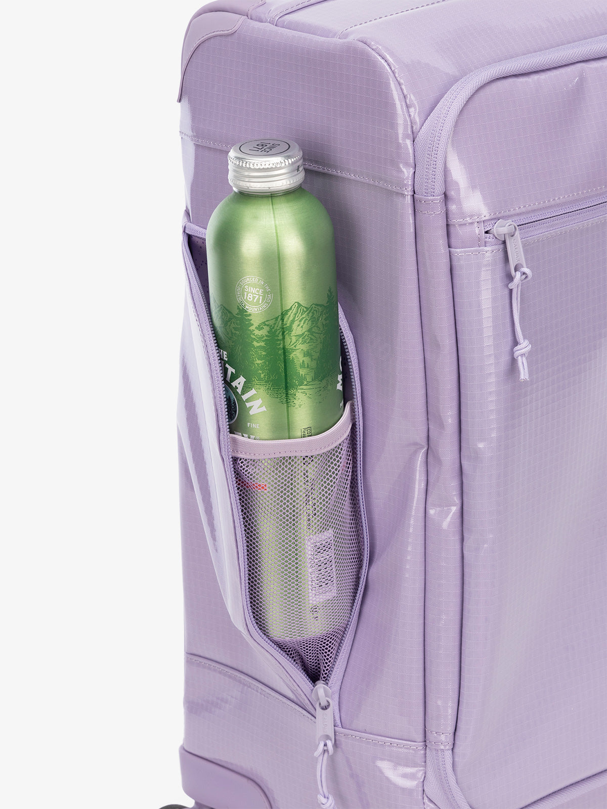Studio product shot of side bottle holder pocket of CALPAK Terra 35L Carry-On luggage with soft shell and 360 spinner wheels in purple; LTR1020-AMETHYST