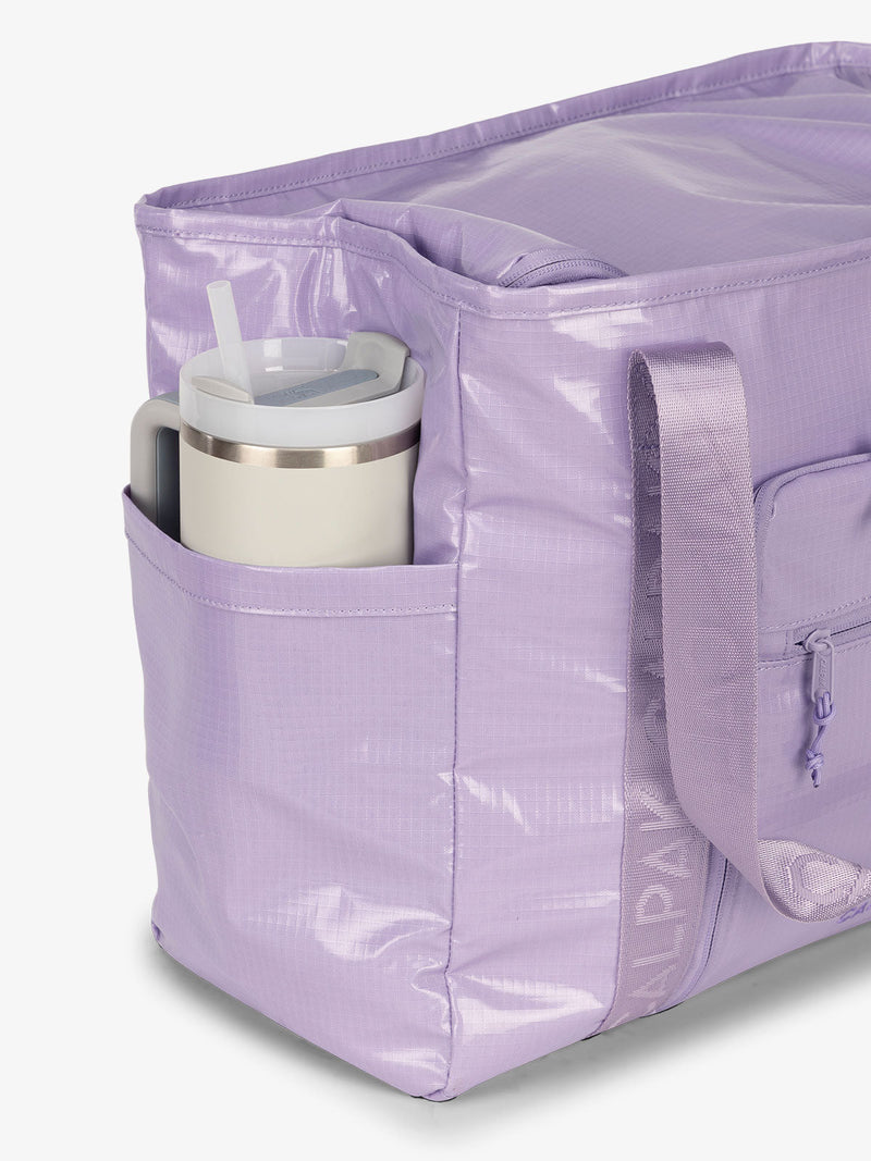 CALPAK Terra 35L Water Resistant Zippered Tote Bag with exterior side pocket that can fit large water bottle in amethyst purple