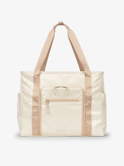 CALPAK Terra 35L Water Resistant Zippered Tote Bag made with durable recycled ripstop exterior, nylon webbing tote straps and multiple exterior pockets in white sands; TTO2401-WHITE-SANDS