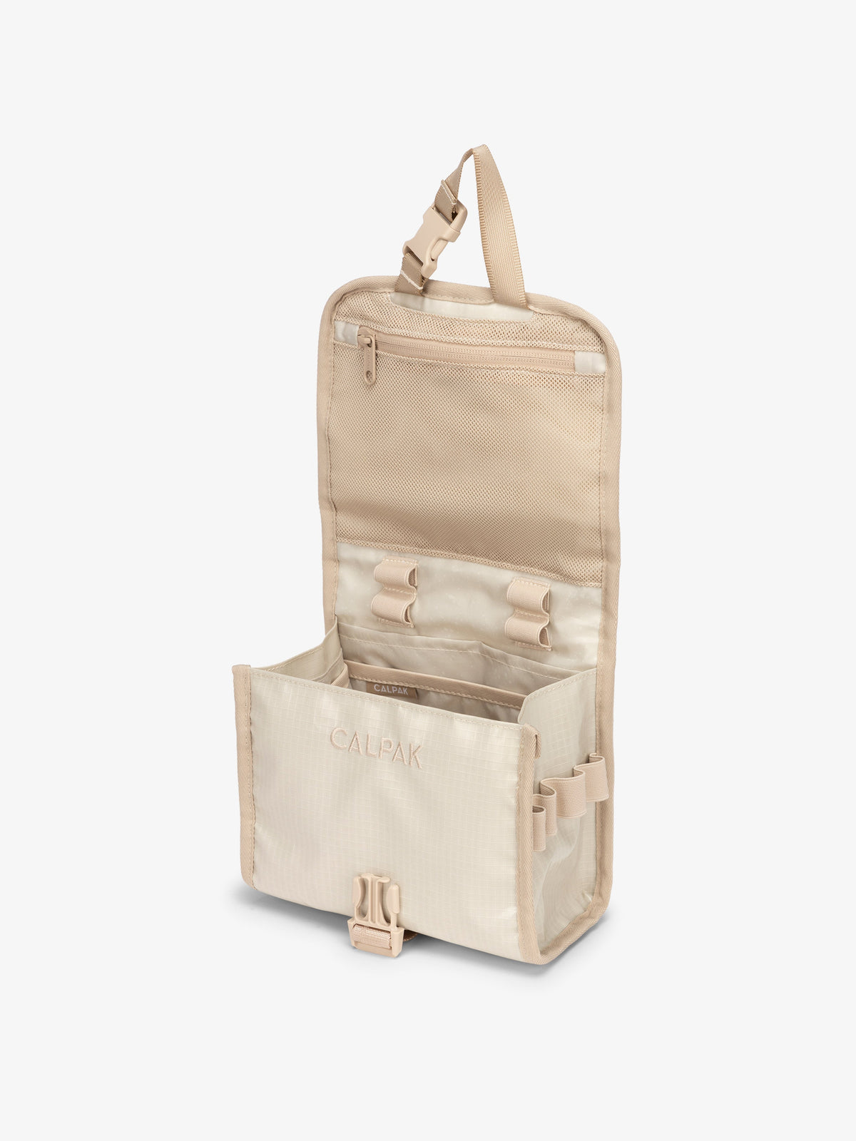 CALPAK Terra Hanging Travel Toiletry Bag for women with buckle closure, hanging hook and multiple compartments in beige; THY2201-WHITE-SANDS