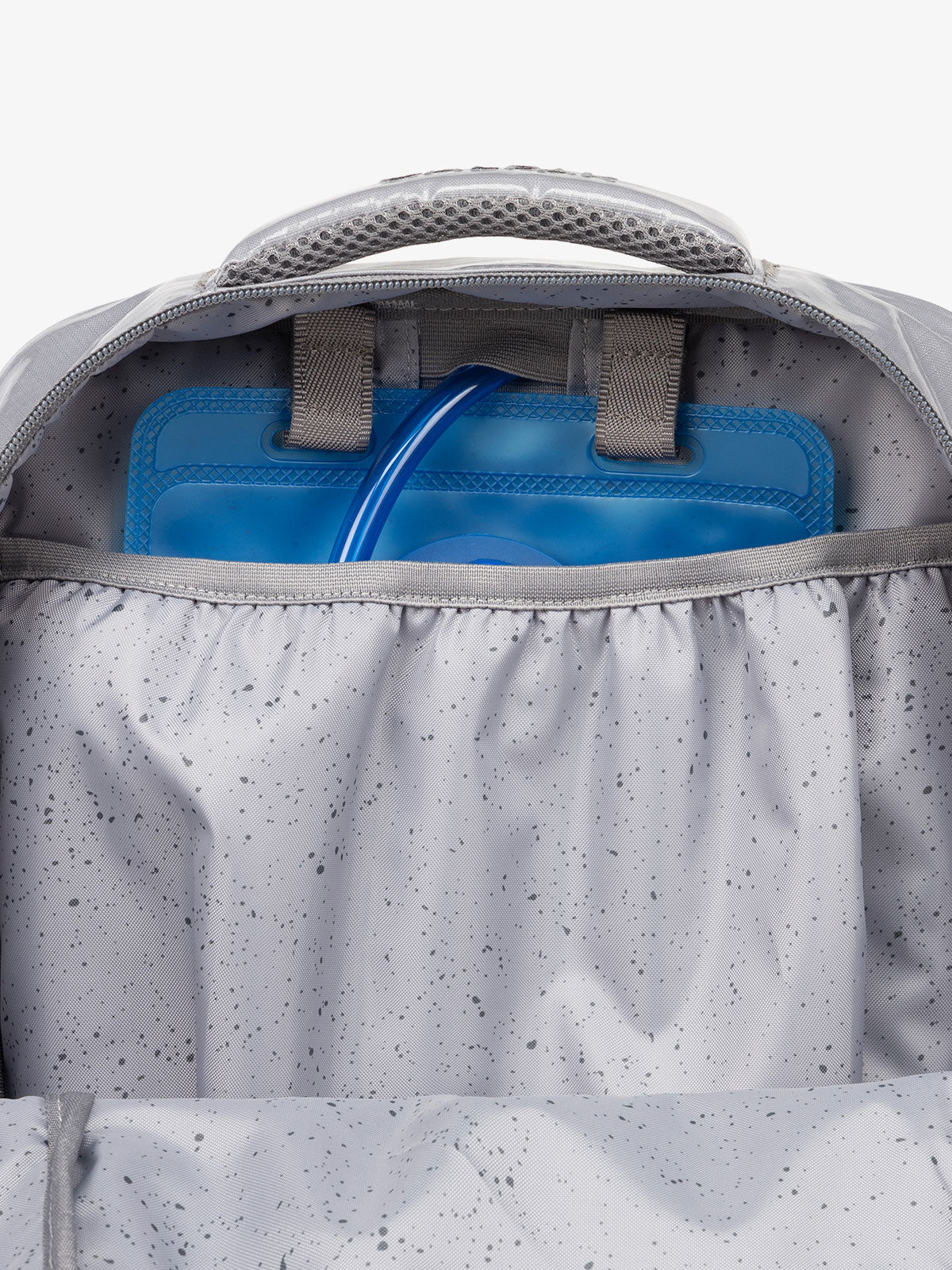 Close up of CALPAK 2L removable hydration reservoir back-slip pocket in storm gray; BPT2201-STORM