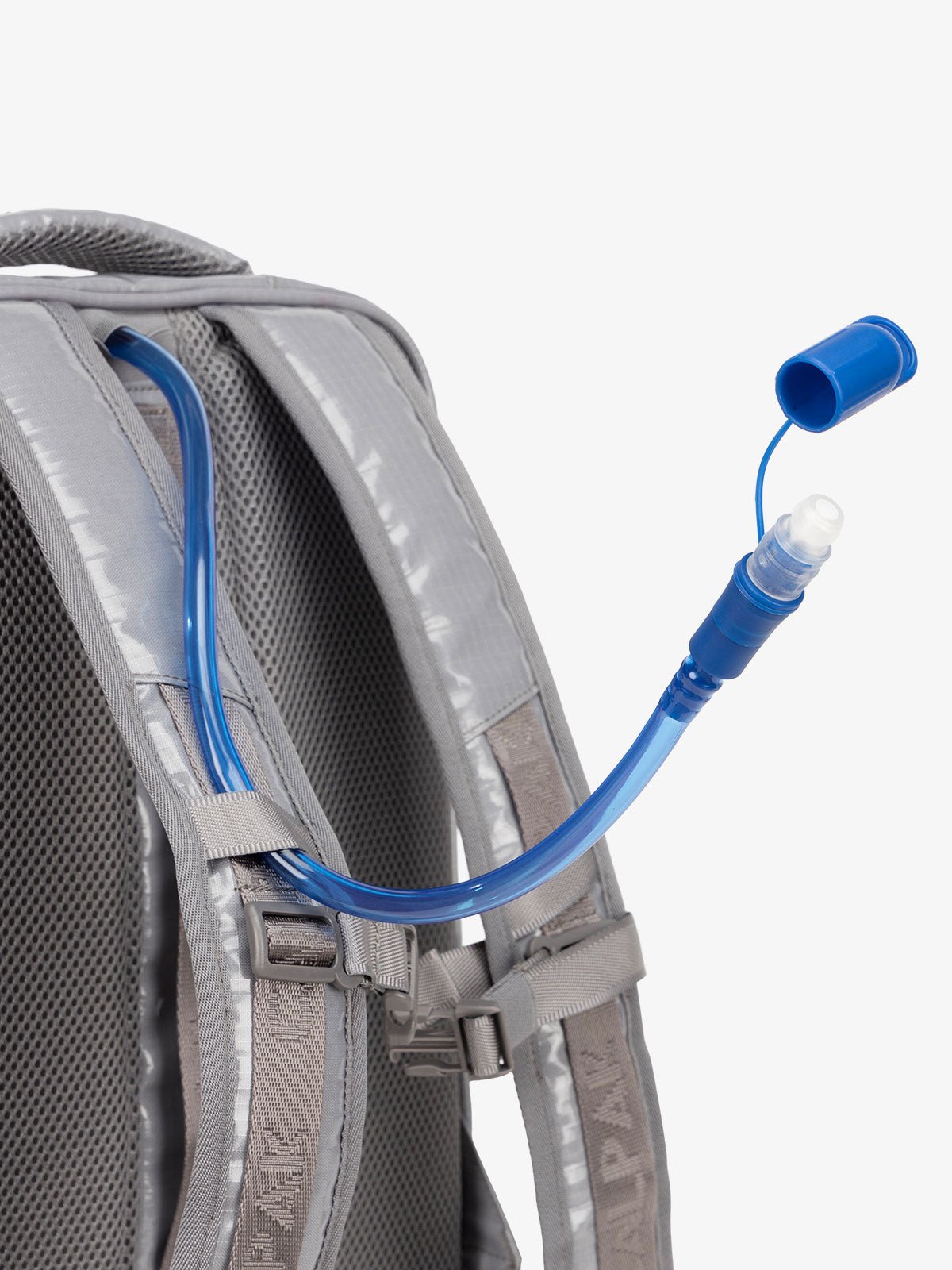 Close up of removable hydration reservoir straw with valve cap in storm gray