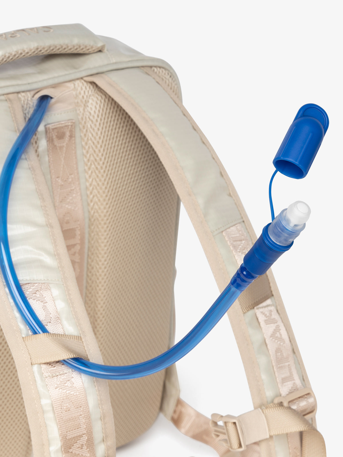 Close up of CALPAK removable hydration reservoir straw in off-white; BPT2201-WHITE-SANDS