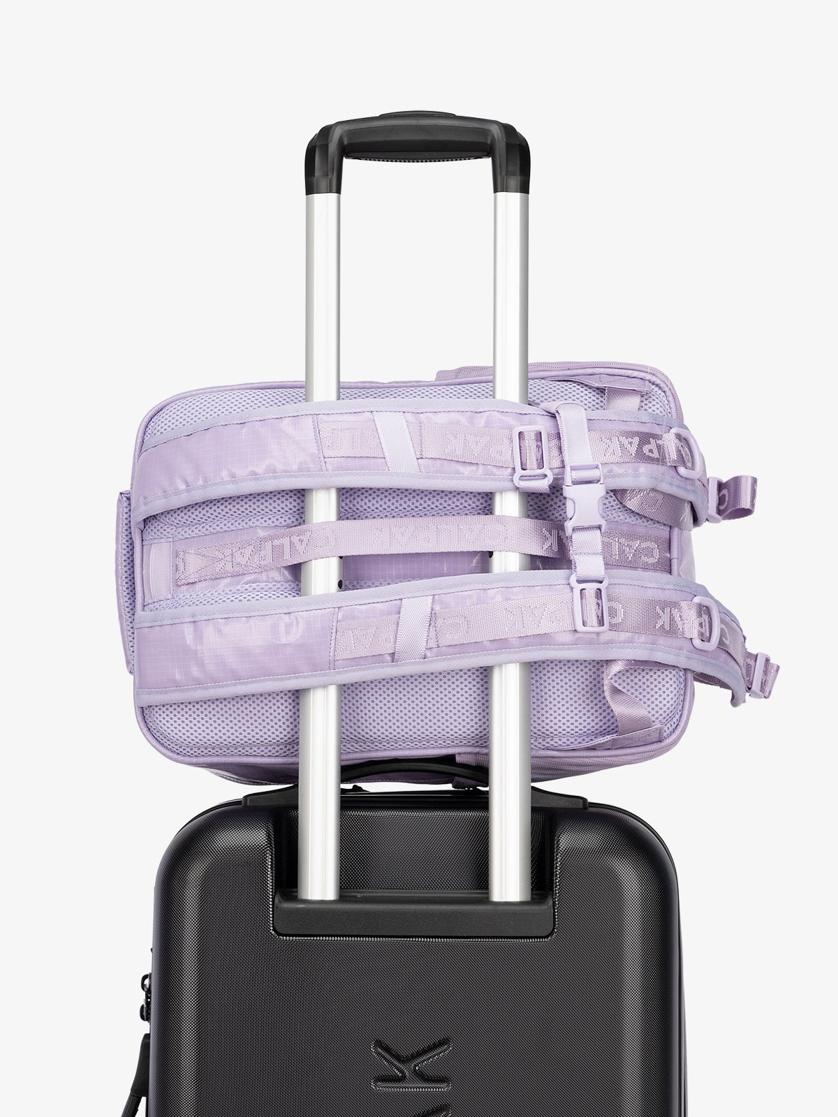 CALPAK hydration backpack with luggage trolley strap and and adjustable shoulder straps in light purple