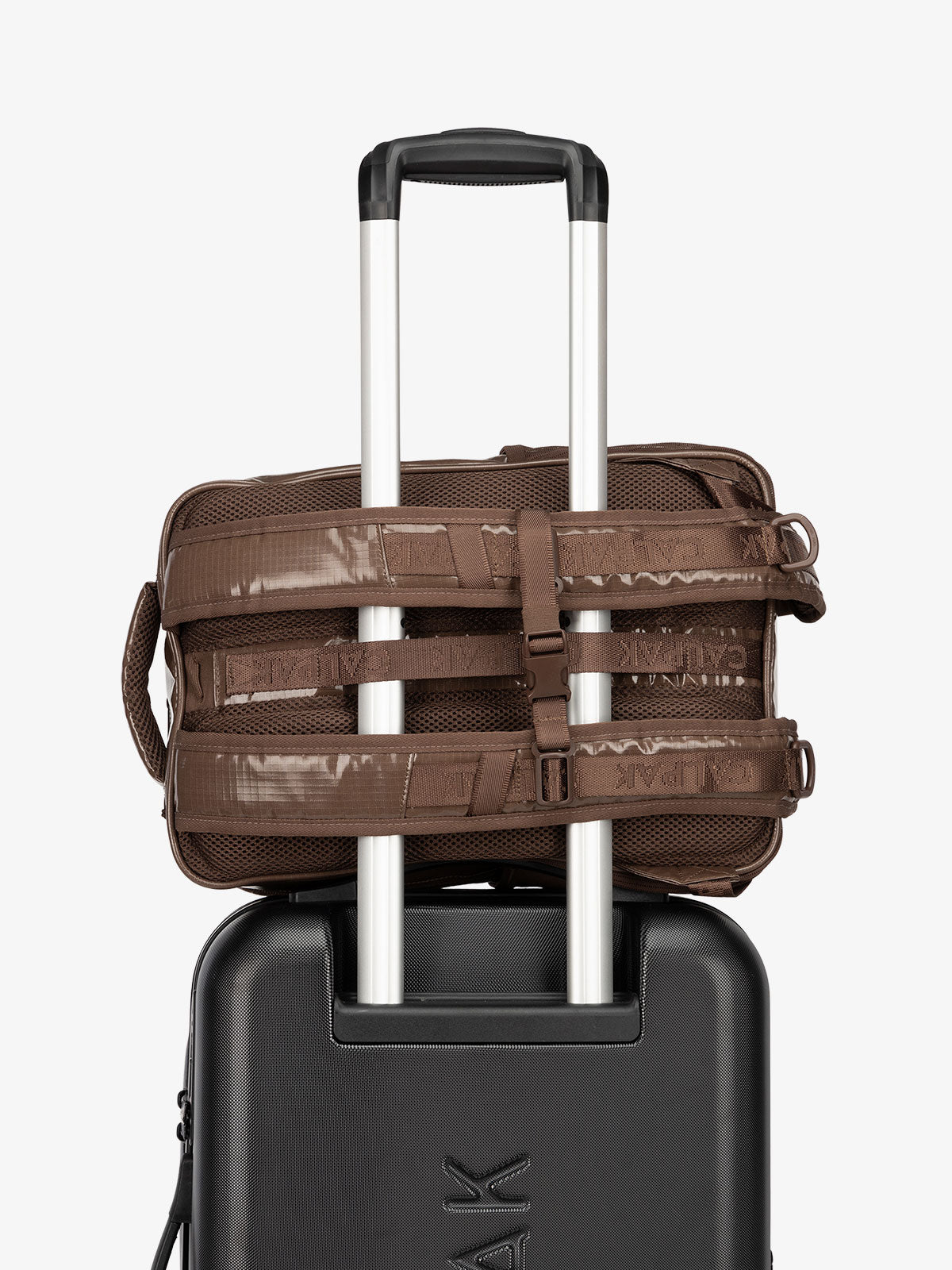 CALPAK hydration backpack with luggage trolley strap and and adjustable shoulder straps in brown; BPT2201-CACAO