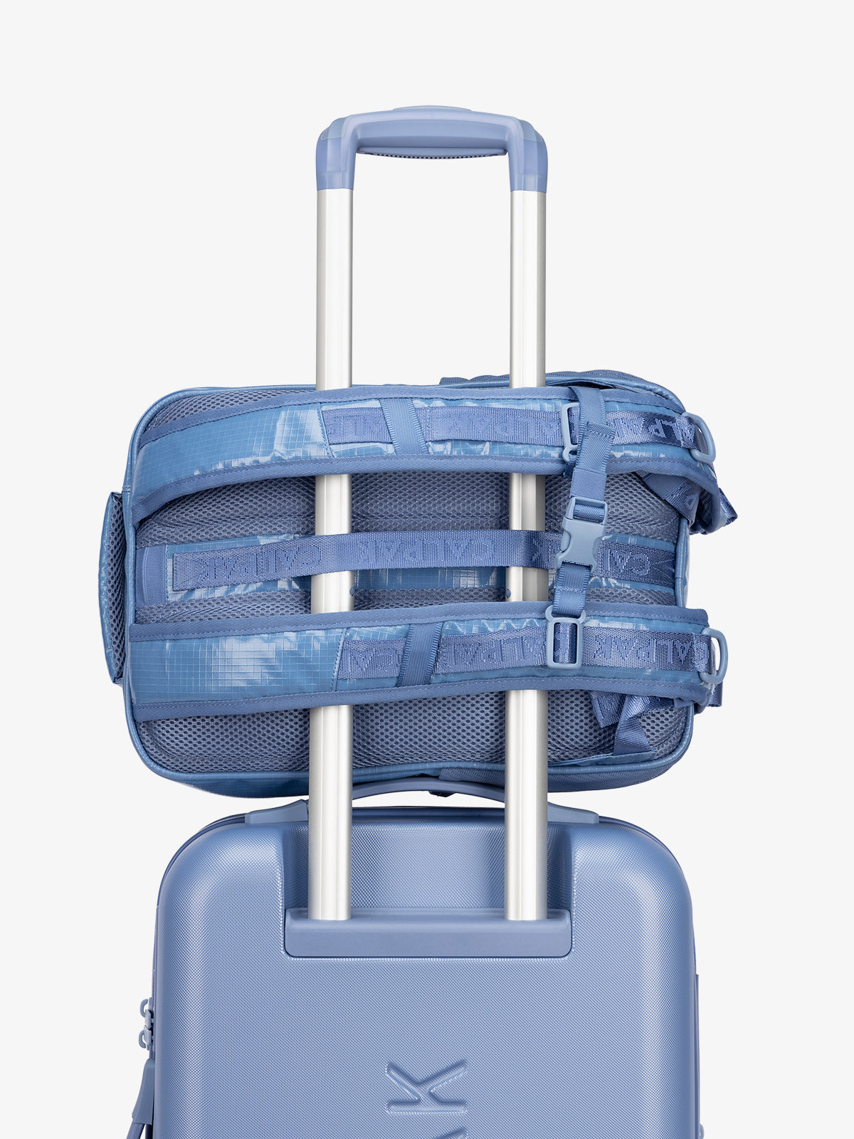 CALPAK hydration backpack with luggage trolley strap and and adjustable shoulder straps in blue; BPT2201-GLACIER