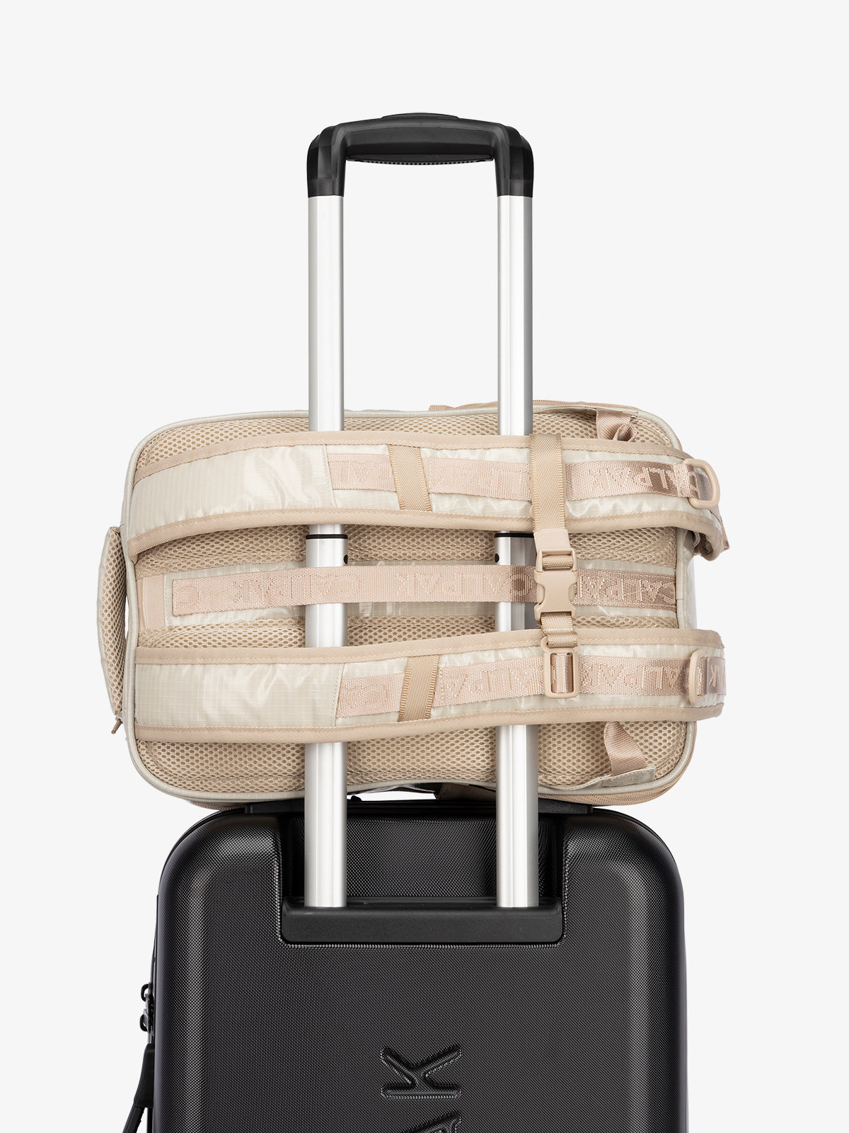 CALPAK hydration backpack with luggage trolley strap and and adjustable shoulder straps in white sands; BPT2201-WHITE-SANDS