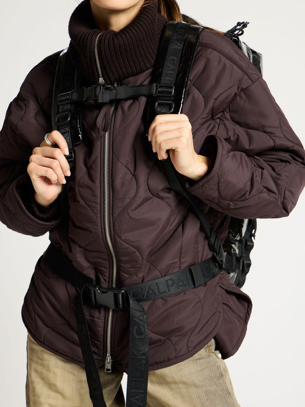 Model displaying adjustable sternum strap of black terra large 50L duffel backpack