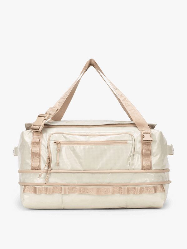CALPAK Terra Large 50L Duffel Backpack expandable up to 2" in beige white sands