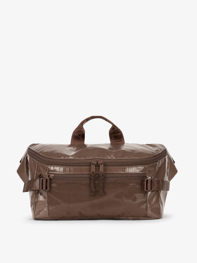 CALPAK Terra Sling Bag with mesh front pocket and top handle in brown cacao; CBH2201-CACAO view 1