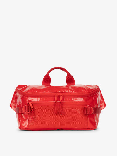 CALPAK Terra Sling Bag with mesh front pocket and top handle in red flame; CBH2201-FLAME view 1