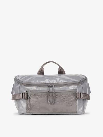 CALPAK Terra Sling Bag with mesh front pocket and top handle in gray storm; CBH2201-STORM