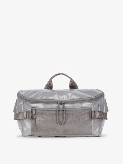 CALPAK Terra Sling Bag with mesh front pocket and top handle in gray storm; CBH2201-STORM view 1