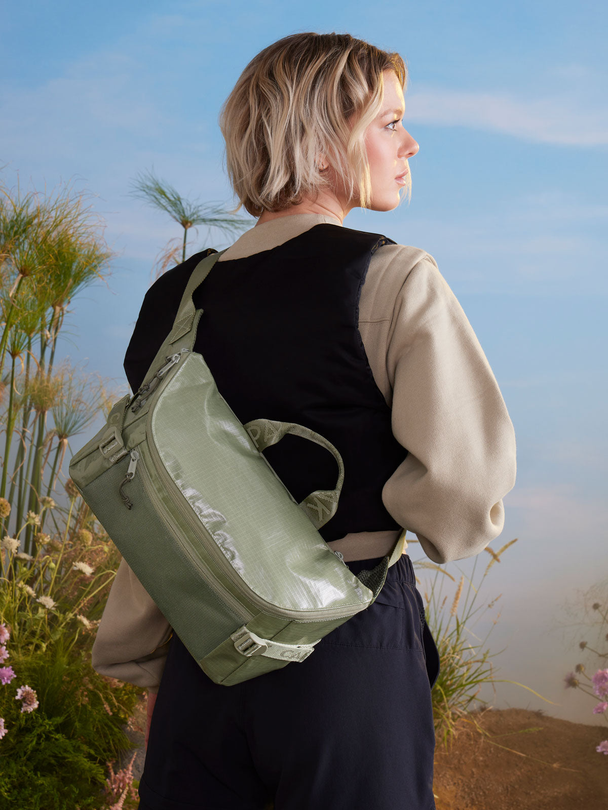 woman with CALPAK sling shoulder bag; CBH2201-JUNIPER