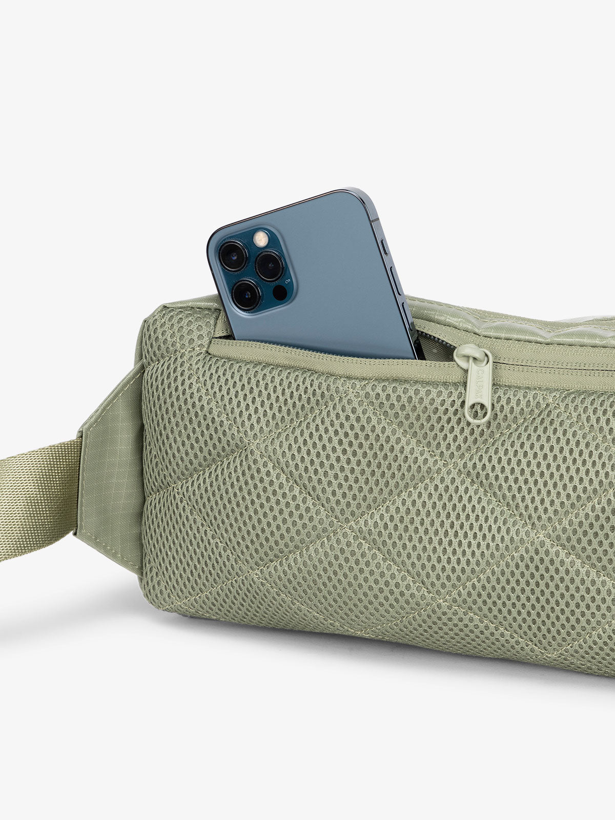 CALPAK Small sling bag with padded back and hidden zippered pocket in green; BBT2301-JUNIPER