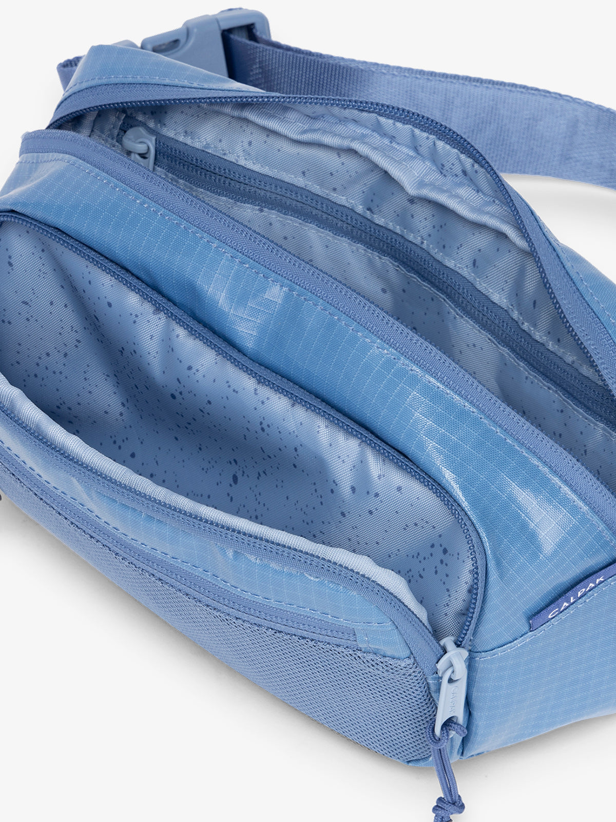 Terra small belt bag with multiple interior pockets and water resistant exterior in glacier blue