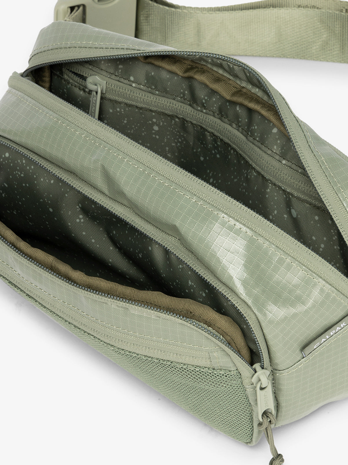 Terra hiking belt bag with multiple interior pockets and water resistant exterior in juniper green