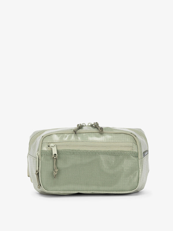 CALPAK Terra small sling bag with mesh front pocket in juniper
