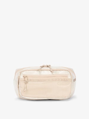 CALPAK Terra small sling bag with mesh front pocket in white sands; BBT2301-WHITE-SANDS