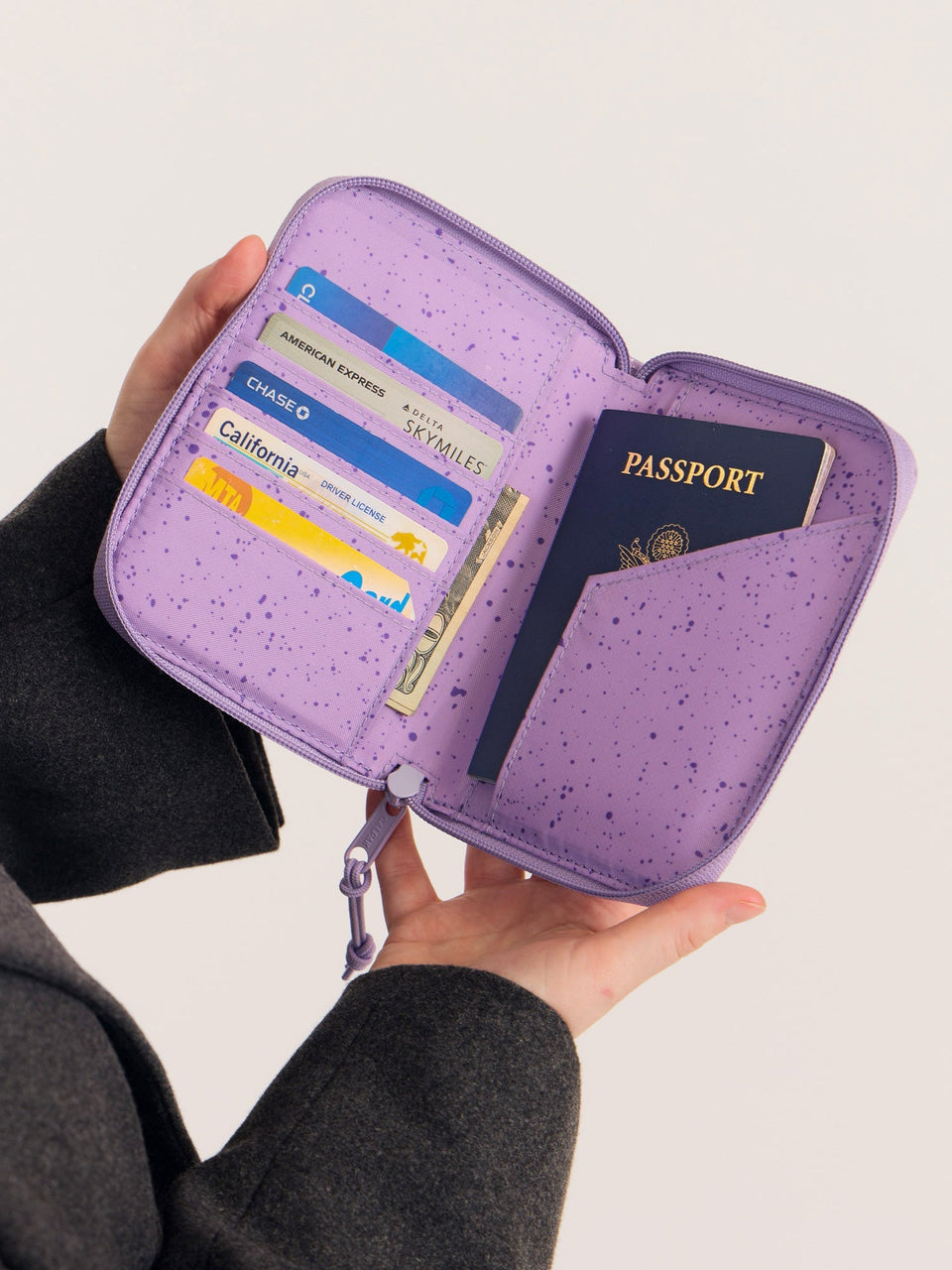 CALPAK Terra Zippered Passport Wallet in Amethyst light purple opened view with cards and passport; ATPW2501-AMETHYST