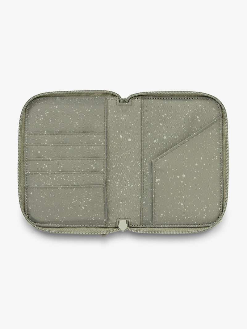 CALPAK Terra Zippered Passport Wallet interior features with card slot and passport slip in juniper