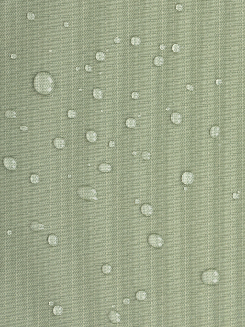 Water resistant material shown with water droplets on CALPAK Terra Zippered Passport Wallet in olive green Juniper
