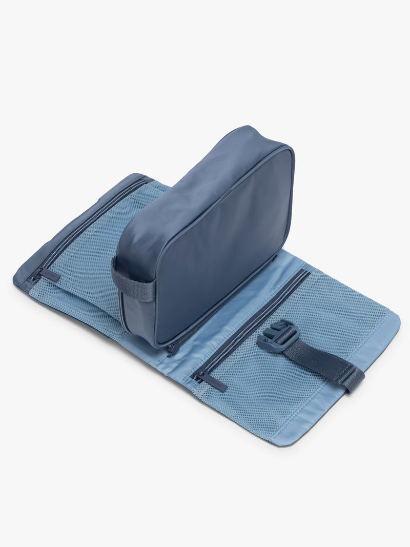 Opened CALPAK Fit Hanging Dopp Kit in blue Indigo