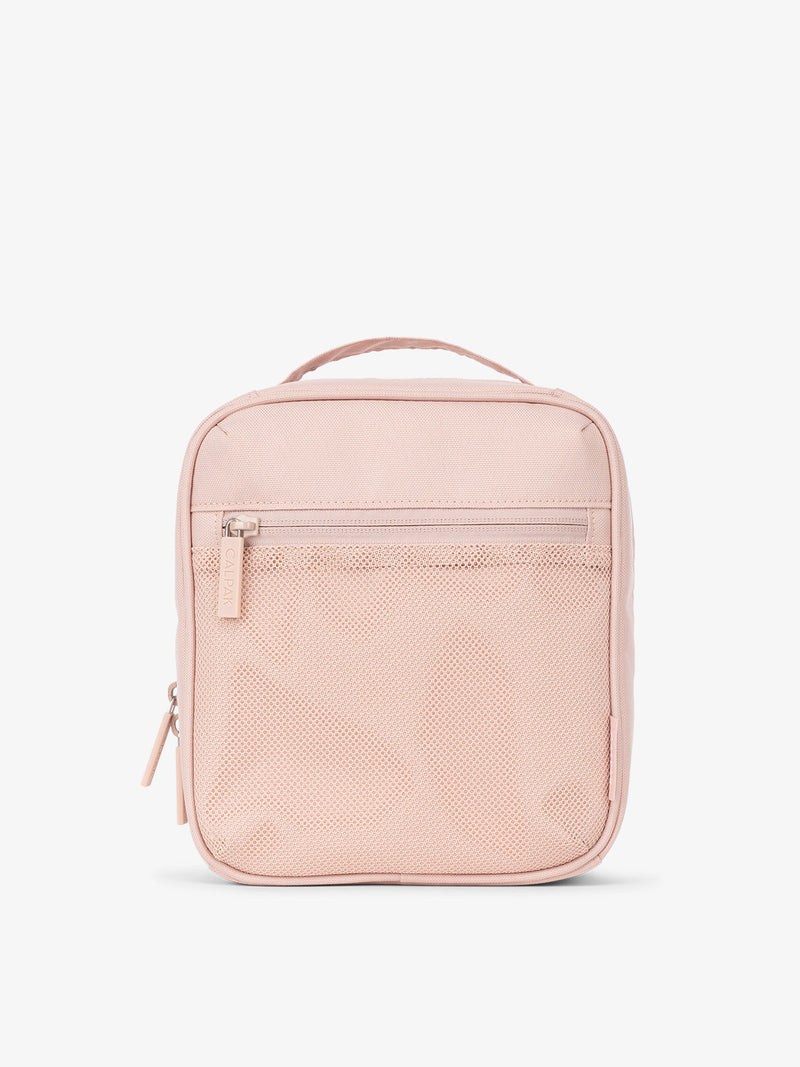 Front-view of CALPAK The Everything Cube made with durable exterior material featuring exterior mesh pocket and top handle in pink sand