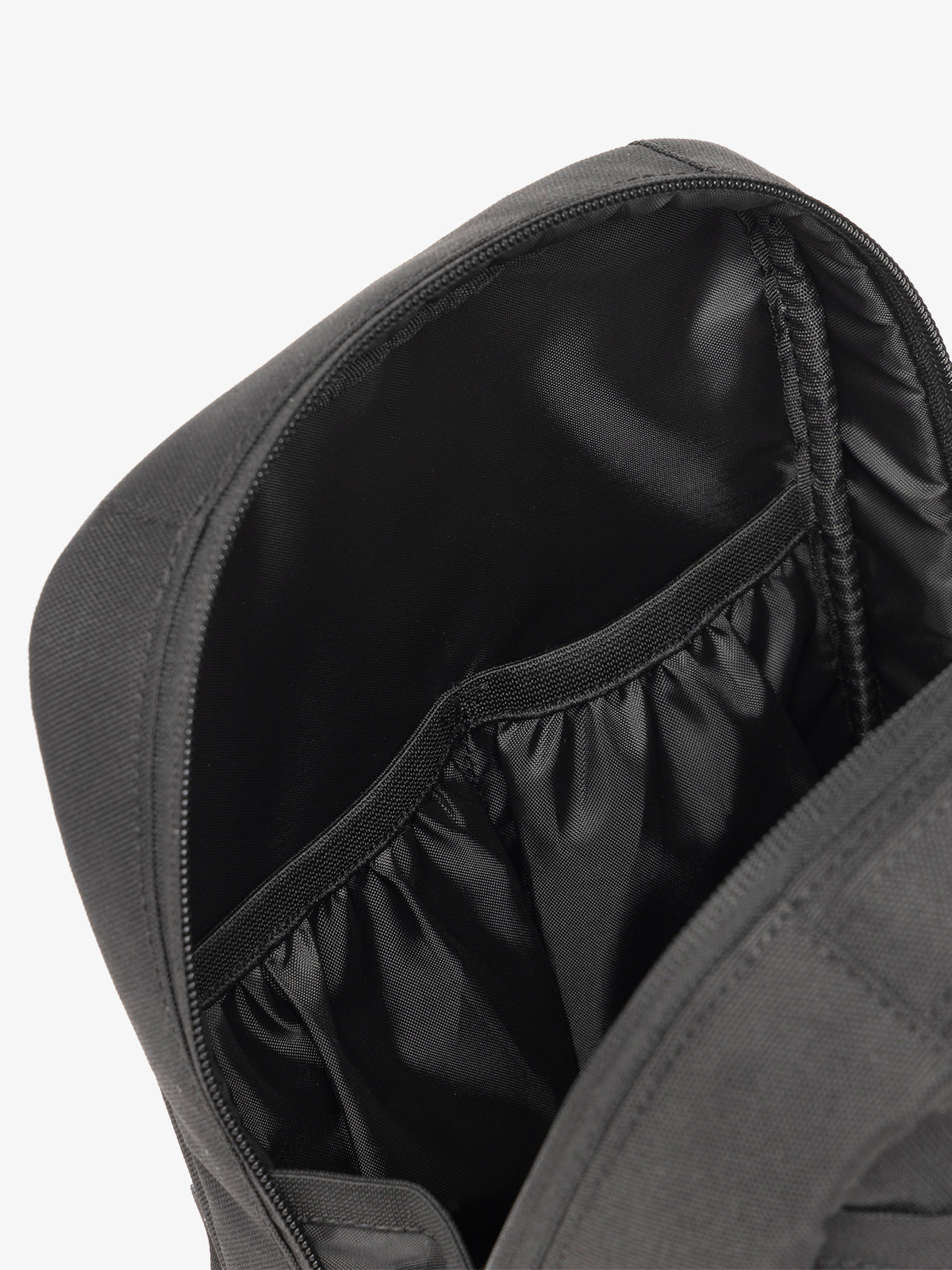 Interior view of CALPAK The Everything Cube featuring water resistant lining and interior pockets in black; ACE2401-BLACK