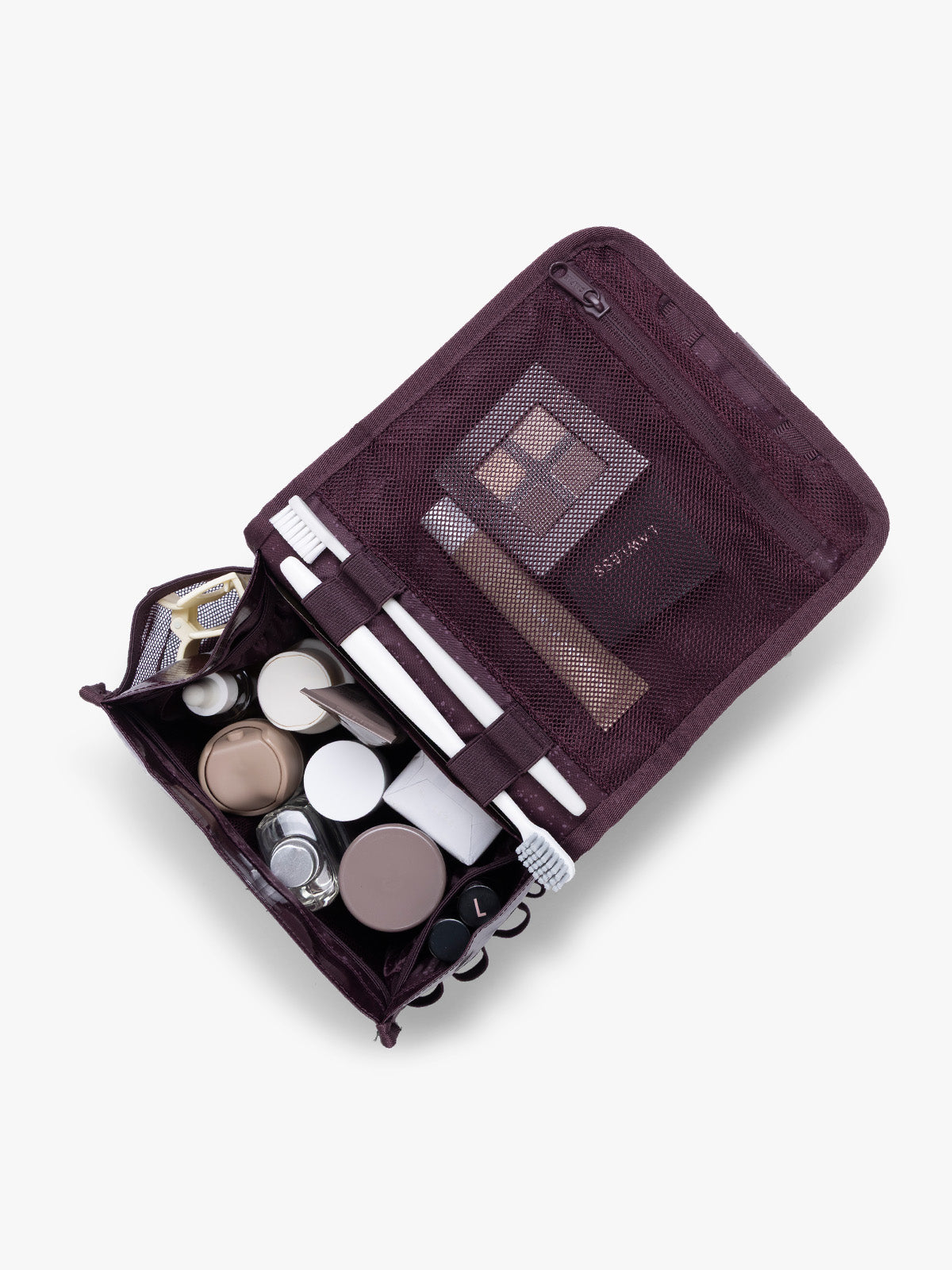 CALPAK Terra Hanging Toiletry Bag  storing makeup and toiletries in dark red  Dark Cherry on a white background; THY2201-DARK-CHERRY