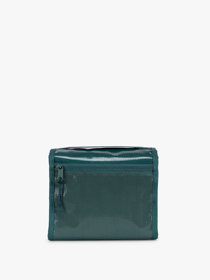 Back side with zipper of CALPAK Terra Hanging Toiletry Bag to store makeup and toiletries in blue green Kale on a white background