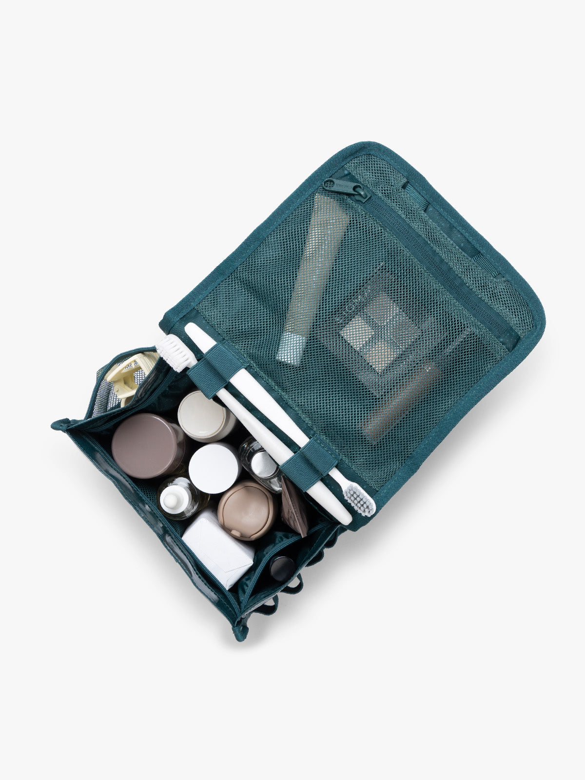 CALPAK Terra Hanging Toiletry Bag storing makeup and toiletries in blue green Kale on a white background; THY2201-KALE
