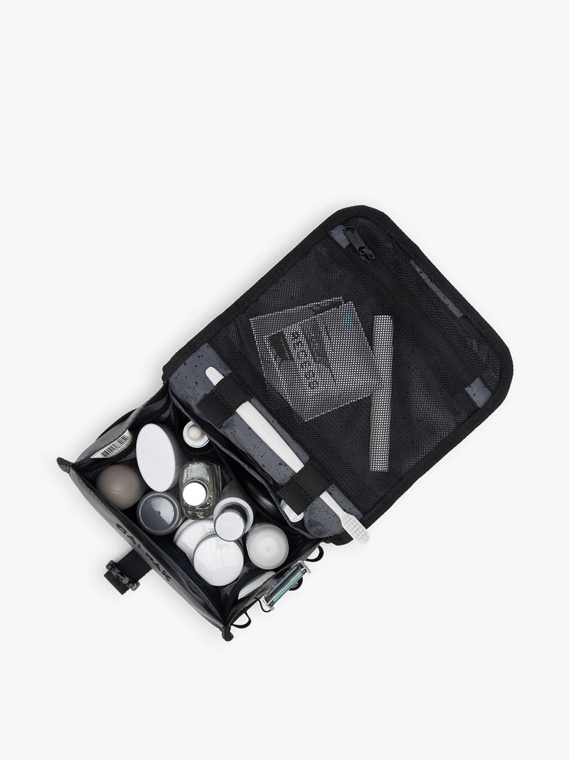 Items inside CALPAK Terra Hanging Toiletry Bag in black Matte Obsidian